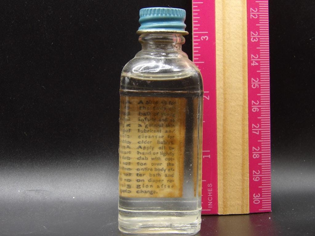 Vintage Johnson & Johnson Baby Oil Glass Bottle — 1¼ fl oz with Blue Metal Cap