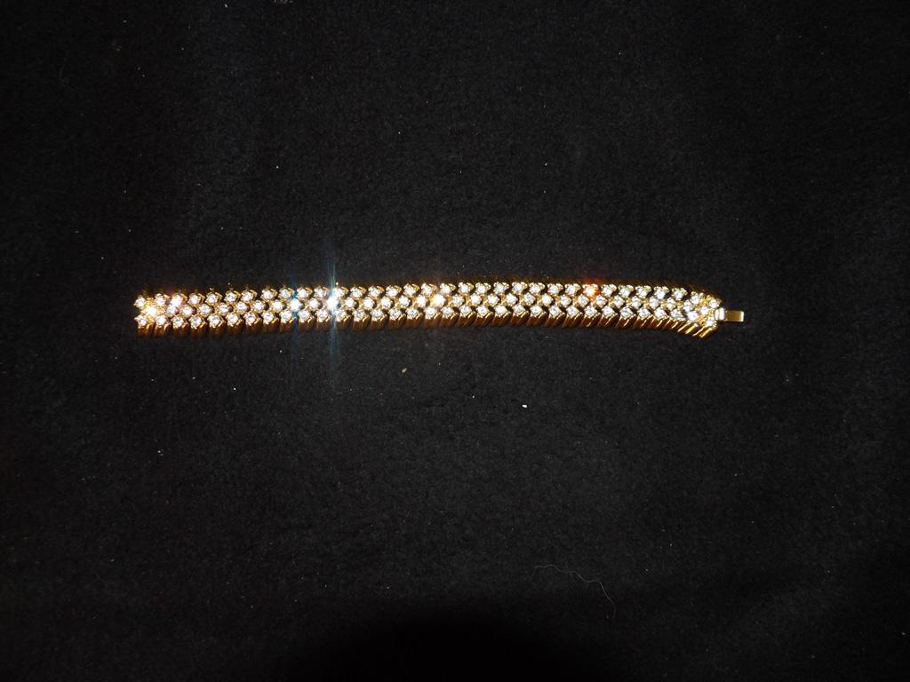 Joan Rivers Gold Tone Triple Row Clear Rhinestone Bracelet with Logo Clasp